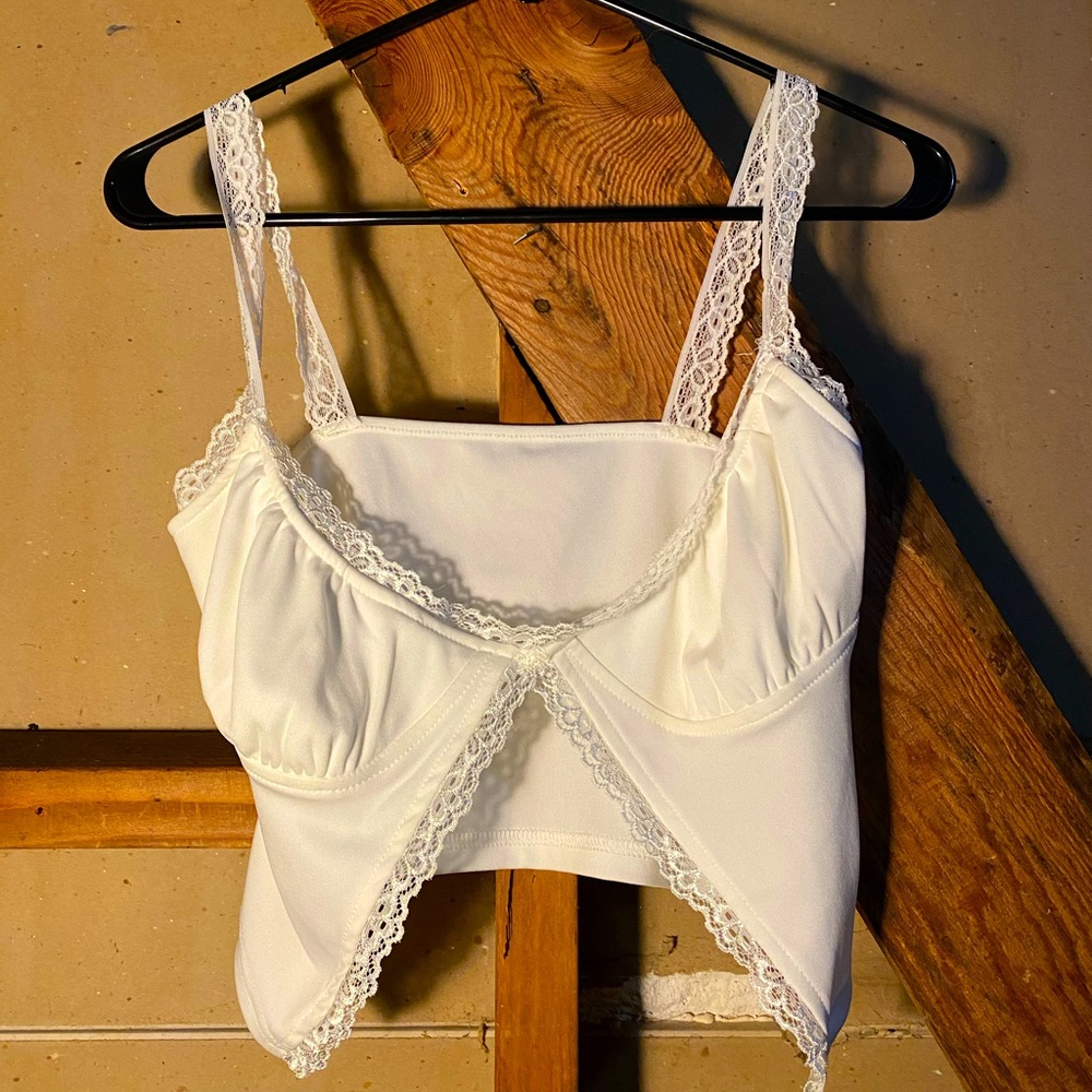 White, low v neck shirt